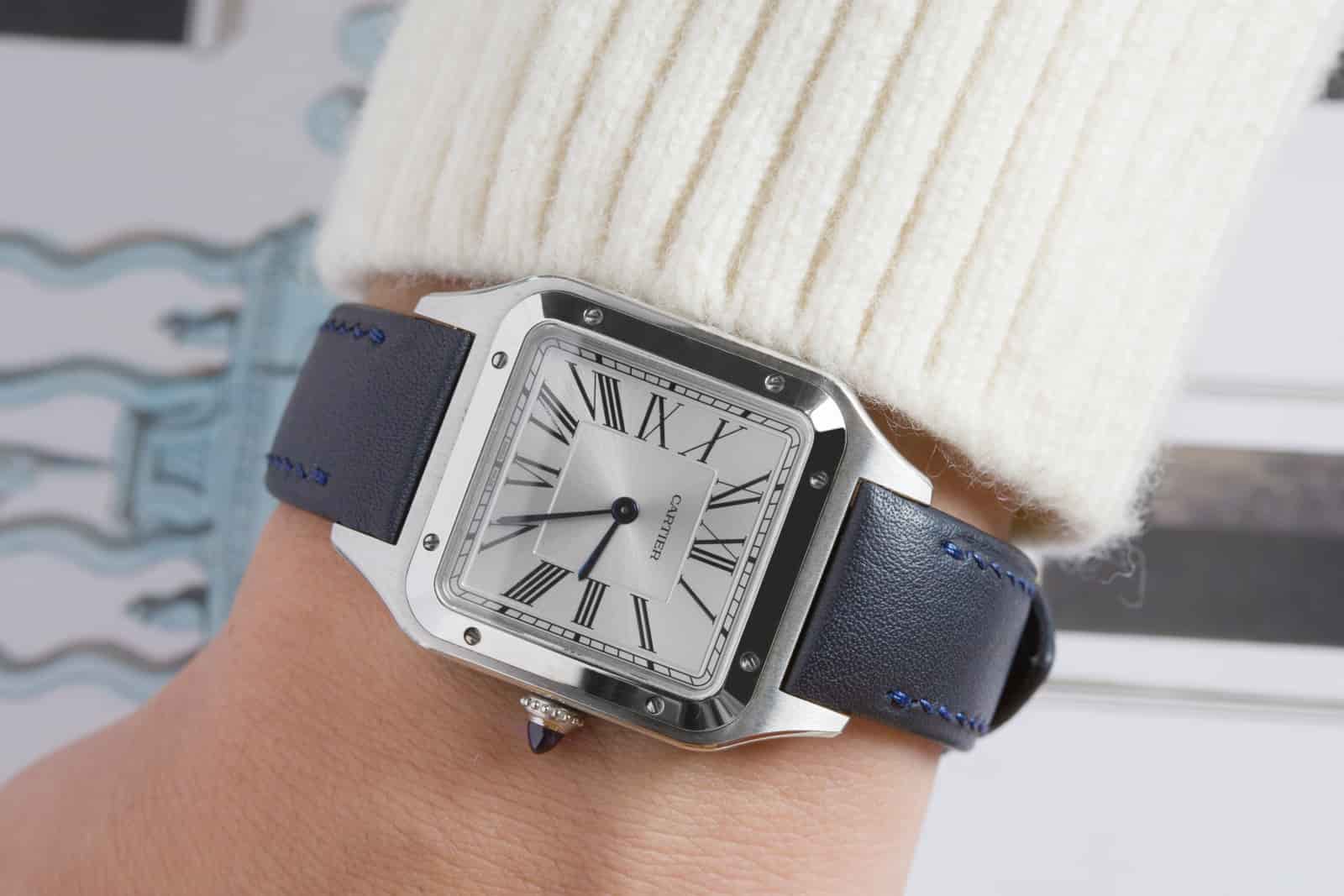Navy calf leather dress watch strap worn on the wrist, showing how the padded strap follows the arm, made by AKC in Vietnam