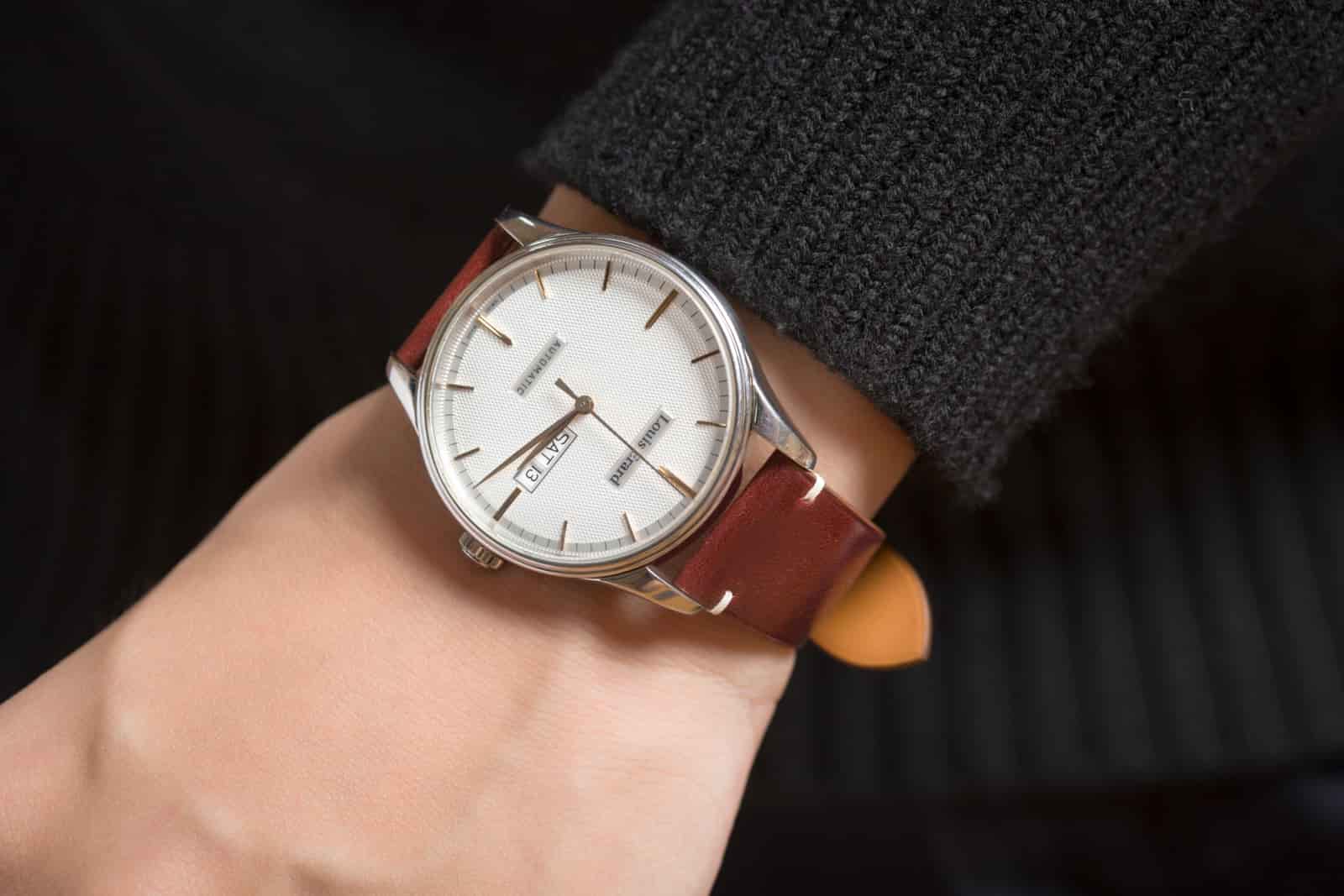 Grained brown calf leather watch strap worn on the wrist, showing how the finish behaves once the strap is in use, produced by AKC